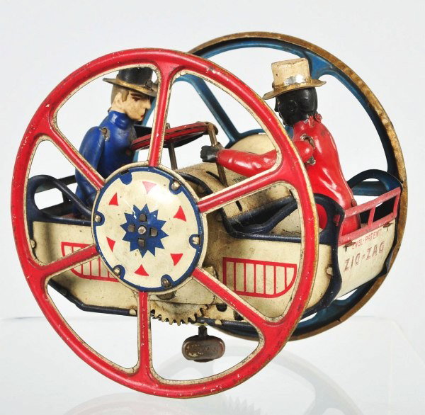 Tin Litho Lehmann Zick- Zack Wind-Up Toy.: German. Working. All original including arms. Lehmann bell mark on bottom. Some overall wear and minor paint loss to hats. Size: