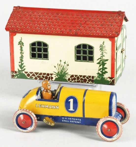 Tin Litho Lehmann Garage with Racer Wind-Up Toy.: German. Working. Original doors on garage and Lehmann bell mark is present. Correct yellow Gallop race car with driver. Car marked "No. 1". Some wear to roof. Provenance: The Donald Kaufman Collection
