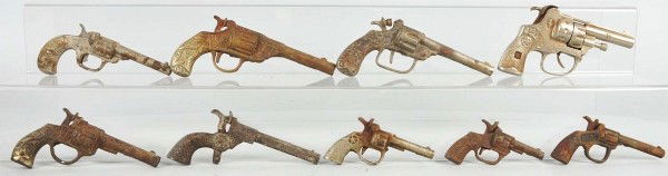 Lot of 9: Assorted Cast Iron Cap Guns.: American. Includes one Dandy with revolving cylinder, one Colt, and others. Some with japanning. Provenance: The Ward Kimball Collection. Size: