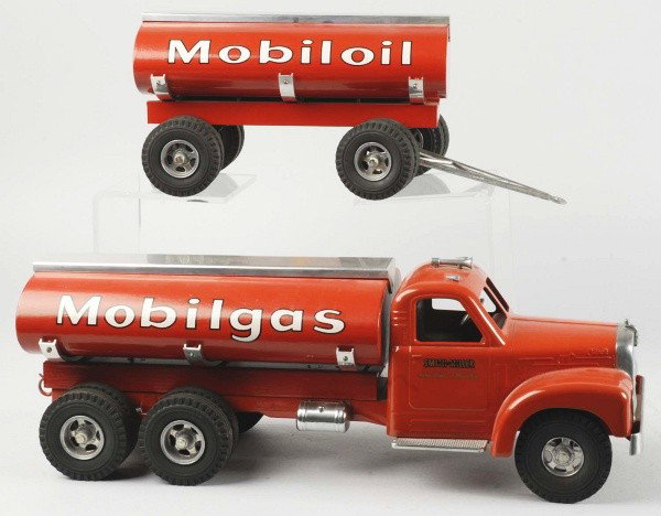 Lot of 2: Pressed Steel Smith-Miller Truck Toys.: Includes Mobilgas truck with two piece trailer and high side lift dump truck. Both trucks are Fred Thompson. Size: Largest: 19" L.