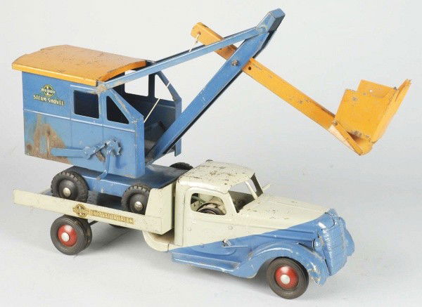 Lot of 2: Pressed Steel Buddy L Truck Toys.: Includes one all original 1941 excavator truck with steam shovel and ramp and one 1934 Express Line van missing rear door and reproduction replacement roof. Excavator truck with overall play wear. Siz