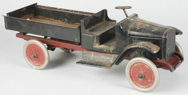 Pressed Steel Buddy L Hook & Ladder Fire Truck.: Circa 1925. Includes an open front cab with brass bell, rear service body, rear step, wrecking boom, hose reel, and ladder racks. A complete professional restoration with replacement parts. Size: 26"