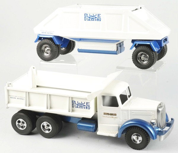 Lot of 2: Fred Thompson Blue Diamond Trucks Toys.: Includes one two-piece Fred Thompson Blue Diamond Cab with two attached Nylint trailers and one Smith-Miller Blue Diamond Mack restored with reproduction parts. Size: Largest: 28" L.