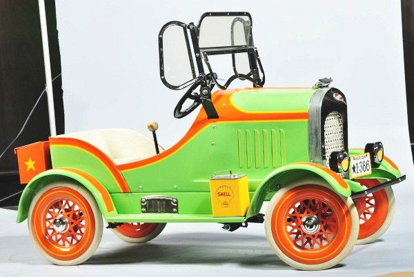 American National Cord Pedal Car.: Circa 1930. Striking lime green with orange color schemes. Full nickeled appointments, exceptional grill detail, full spoked wheels, deluxe model restored from original body with replacement parts. Si