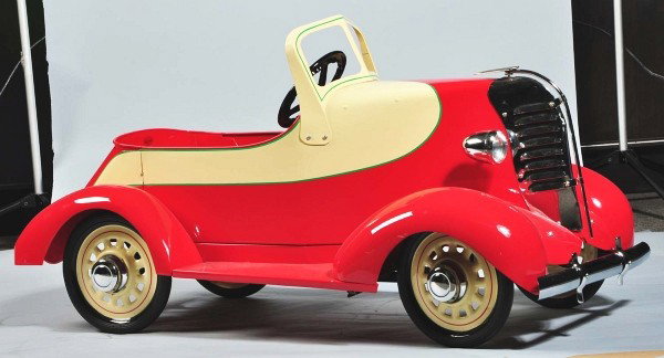 Garton Lincoln Zephyr Pedal Car.: Circa 1933. Classic art styling, stunning body design, professionally restored by Jim Miller. Bright red and cream colored body, nickeled headlights and radiator with dramatic ornament detail. Yellow 