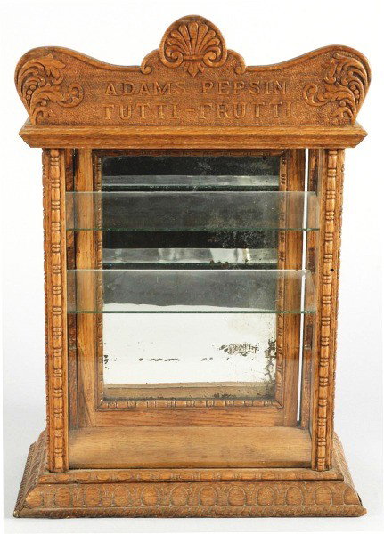 Adams Pepsin Tutti-Frutti Gum Showcase.: Circa 1900. Nicely embossed oak and trim work. Only some splintering and small pieces of wood missing from side and corner. Case finish appears to be original with only light wear and soiling. Size: 1