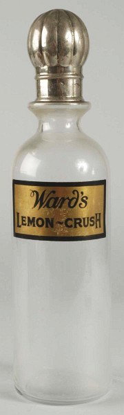 Ward's Lemon Crush Back Bar Bottle with Cap.: 1920s. Nice strong gold leaf fired-on label with only minor scratches and scuffs. Beautiful design to cap. Light wear and soiling overall. Size: 13" T.