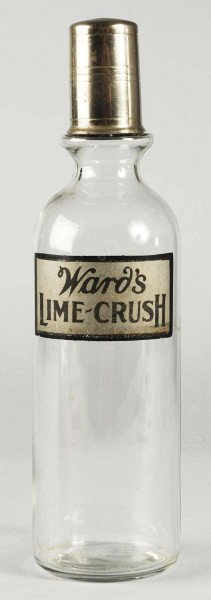 Ward's Lime Crush Back Bar Bottle.: 1920s. Complete with cap. Wonderful label decoration with only light soiling or wear. Size: 12 - 1/2" T.