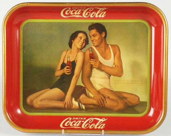 1934 Coca-Cola Serving Tray.: Nice, bright example. When viewed at angle, some minor gloss differences and spider-webbing. Otherwise, nice, clean, bright, and shiny. Presents wonderfully. Size: 13 - 1/4" x 10 - 1/2". Condition: (E