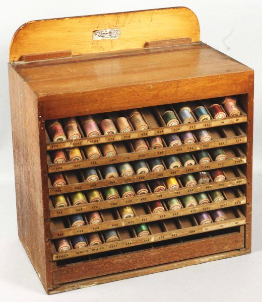 Wooden National Thread Company Spool Cabinet.: Nice oak cabinet with original spools. Original marquee. Size: 20" x 17 - 1/2". Condition: (Very Good).