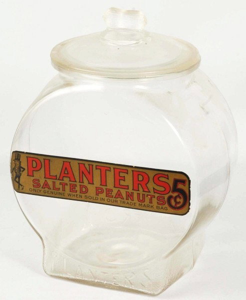Planters Peanut Fish Bowl Jar with Original Label: Nice strong jar with only one chip to lip and light soiling overall. Size: 12 - 3/4" T. Condition: (Excellent).