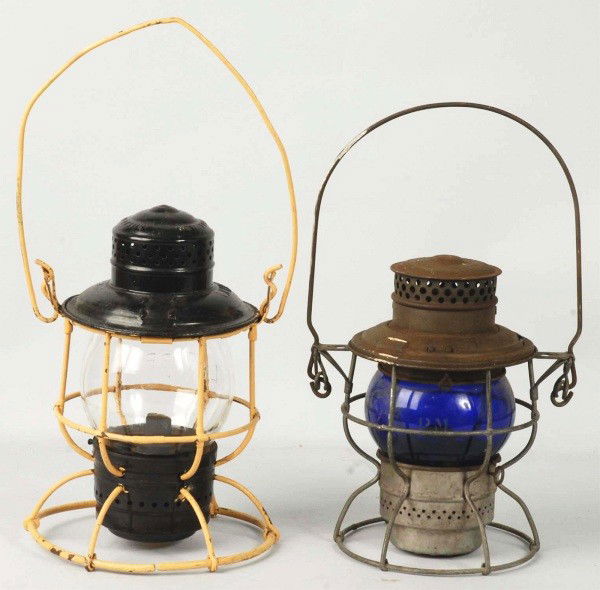 Lot of 2: Railroad Lanterns.: Includes one with blue globe marked "1922 Canada" and one with clear globe embossed "L&N Railroad" on glass. Size: Largest: 16 - 1/2" T with handle. Condition: (Very Good). CORRECTION: Clear globe is