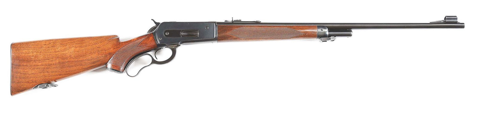 (C) WINCHESTER MODEL 71 LEVER ACTION RIFLE IN .348: Winchester Model 71 "Deluxe" lever action rifle made by Winchester Repeating Arms Company in 1953. 24" blued round Winchester Proof Steel barrel in .348 W.C.F. with hooded ramp front sight and rear 22