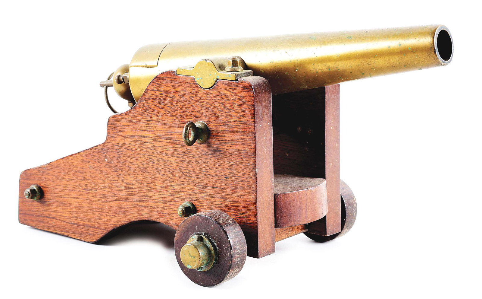THE STRONG FIRE ARM CO. SMALL SIGNAL CANNON.: Breech loading brass signal cannon manufactured by The Strong Fire Arms Company with 2-wheel wooden carriage. A very faded 5-line manufacture name and address is stamped on top rear of cannon. Length 