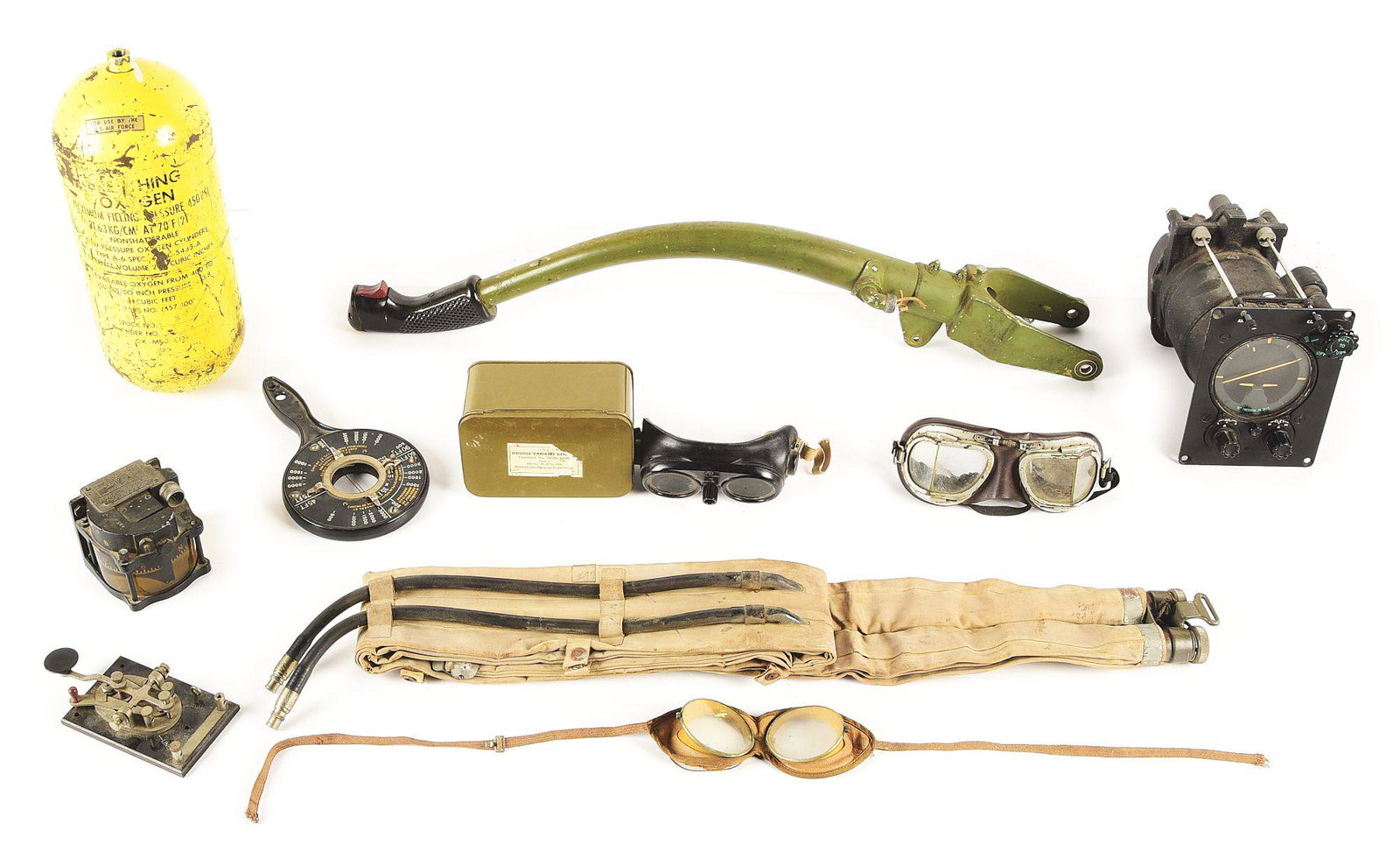LOT OF 10: US WWII EQUIPMENT INCLUDING AVIATION RELATED: Lot consists of: (A) World War II era F4U Corsair control stick. The stick features a variety of markings and is USN marked. (B) US Air Force Type A-6 oxygen tank (C) WWII bank-climb control for S-4 a
