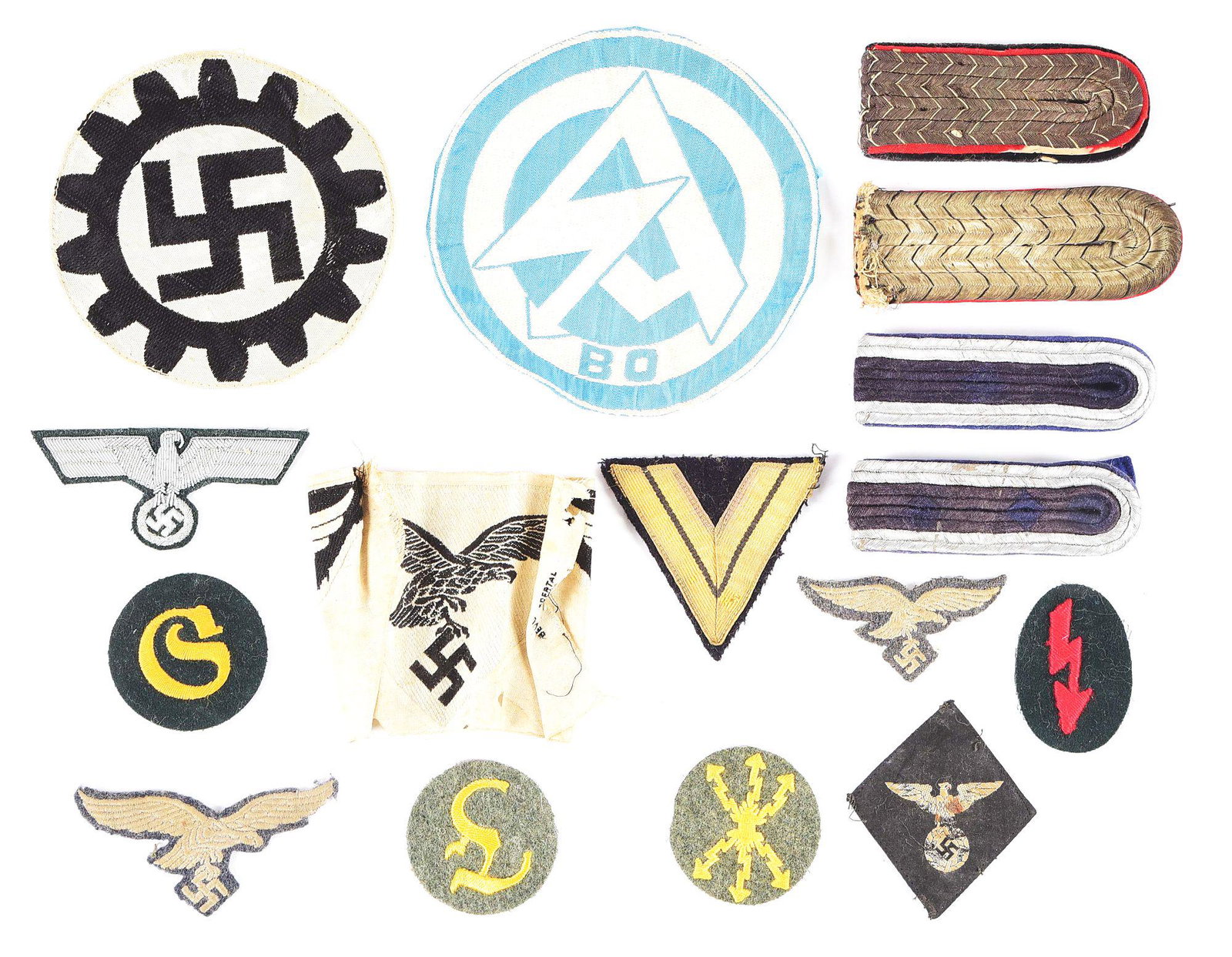 LOT OF 16: THIRD REICH MISCELLANEOUS INSIGNIA.: Lot of miscellaneous Third Reich insignia. Lot contains wool Luftwaffe eagles, bullion Heer officer eagle, shoulder boards, Heer trade patches, sports shirt insignia, etc. CONDITION: Overall very good