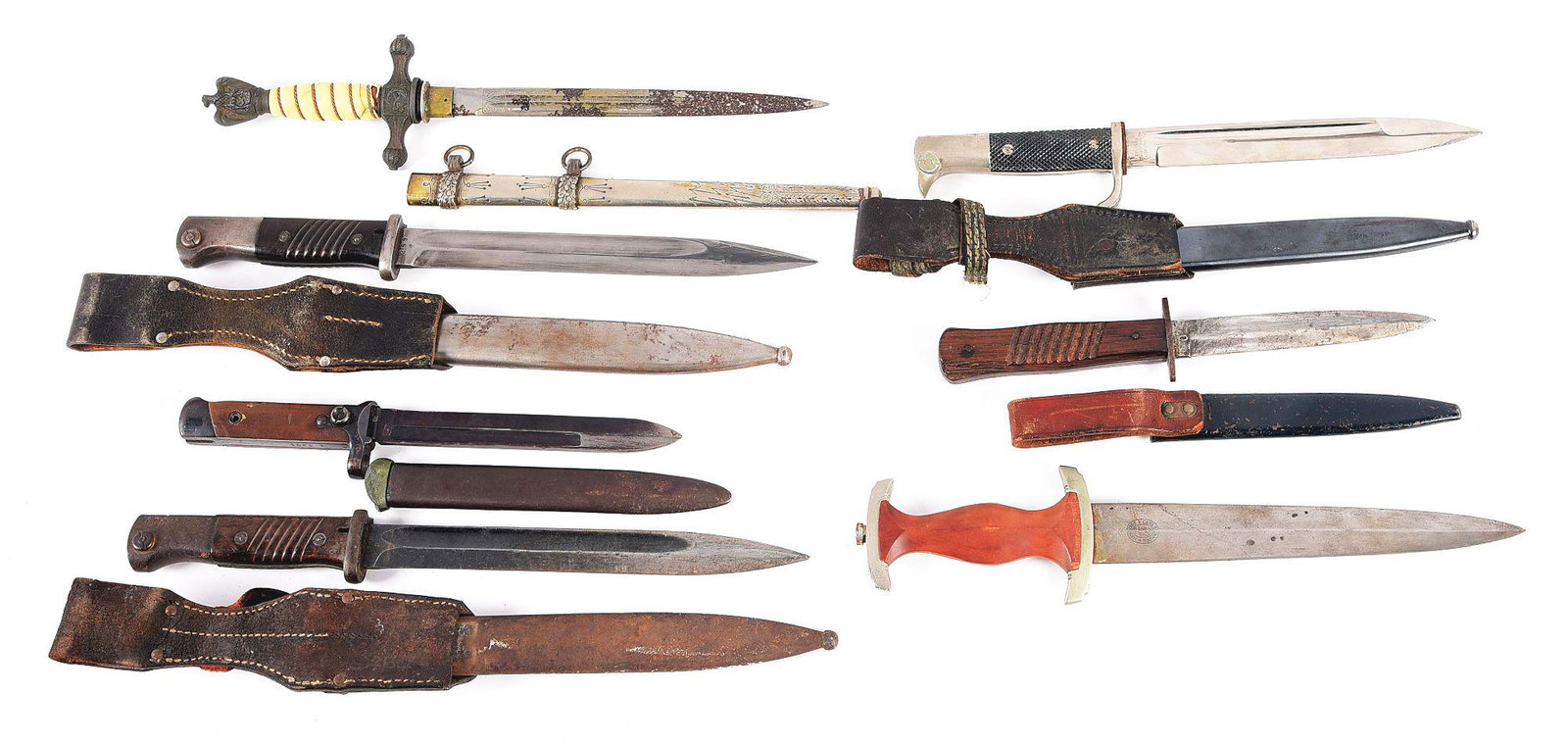 LOT OF 7: GERMAN AND ITALIAN WWII BAYONETS AND DAGGERS: Lot consists of: (A) German Third Reich Kriegsmarine dagger. The dagger's blade is heavily worn with rust. The cross guard and pommel are with heavy cracking throughout. The trylon grip is cracked and
