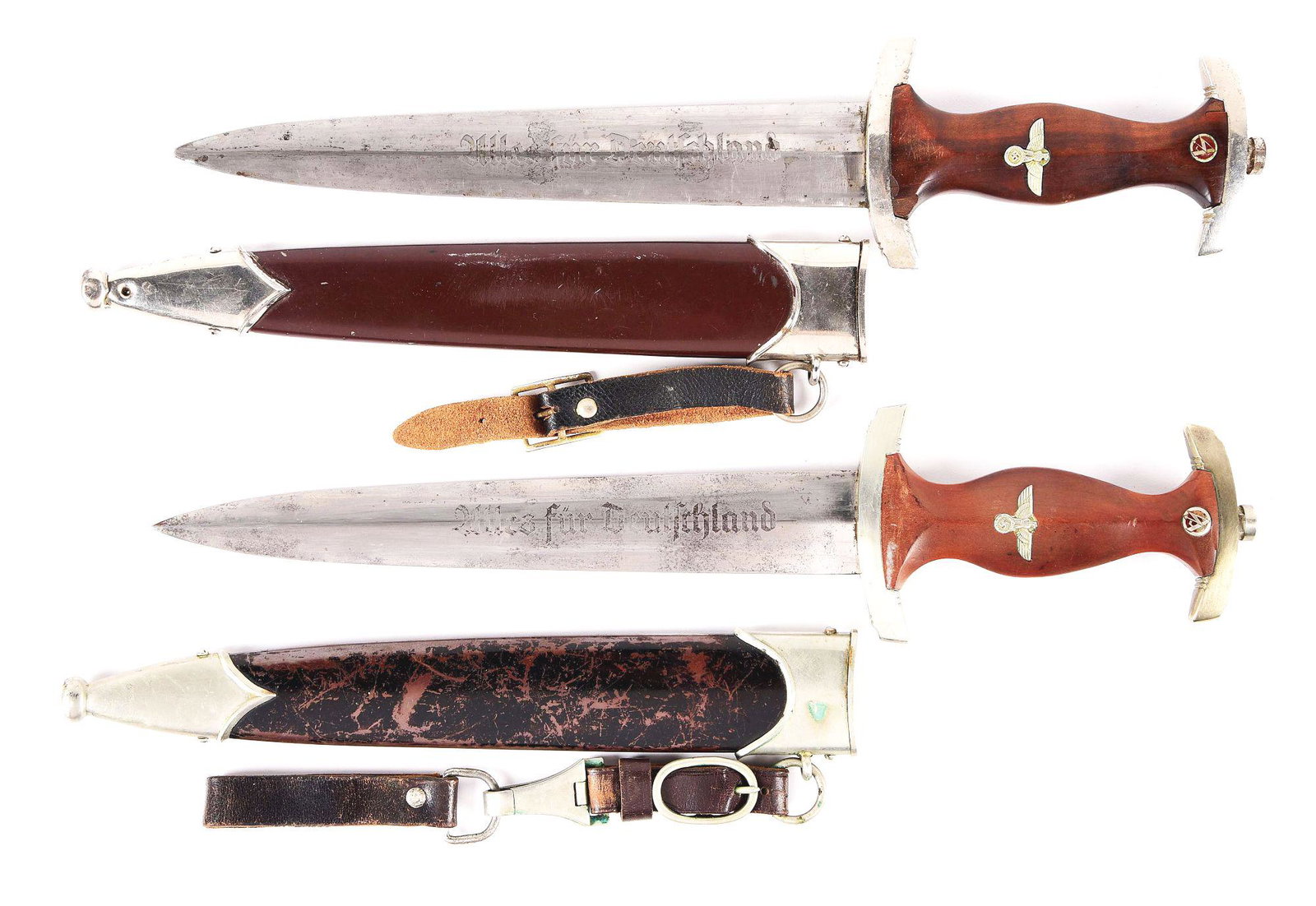 LOT OF 2: THIRD REICH SA & NSKK DAGGERS.: Lot consists of: (A) German Third Reich SA Dagger produced by the maker M7/81 (Karl Tiegel). The steel blade has remnants of the factory cross-graining near the lower guard, while the rest of the blad