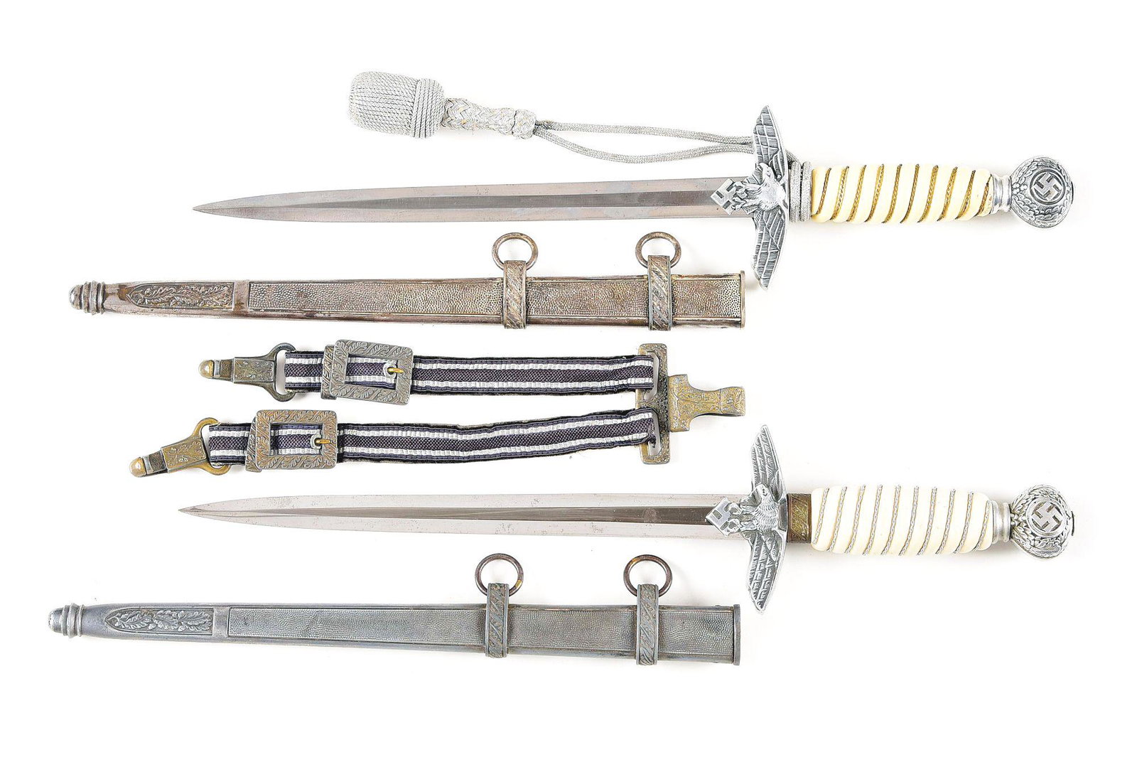 LOT OF 2: GERMAN WWII LUFTWAFFE DAGGERS.: Lot consists of: (A) German World War II Luftwaffe 2nd Model dagger with steel blade maker marked for the maker Tiger. The blade retains its factory cross-graining, but has greyed slightly throughout.