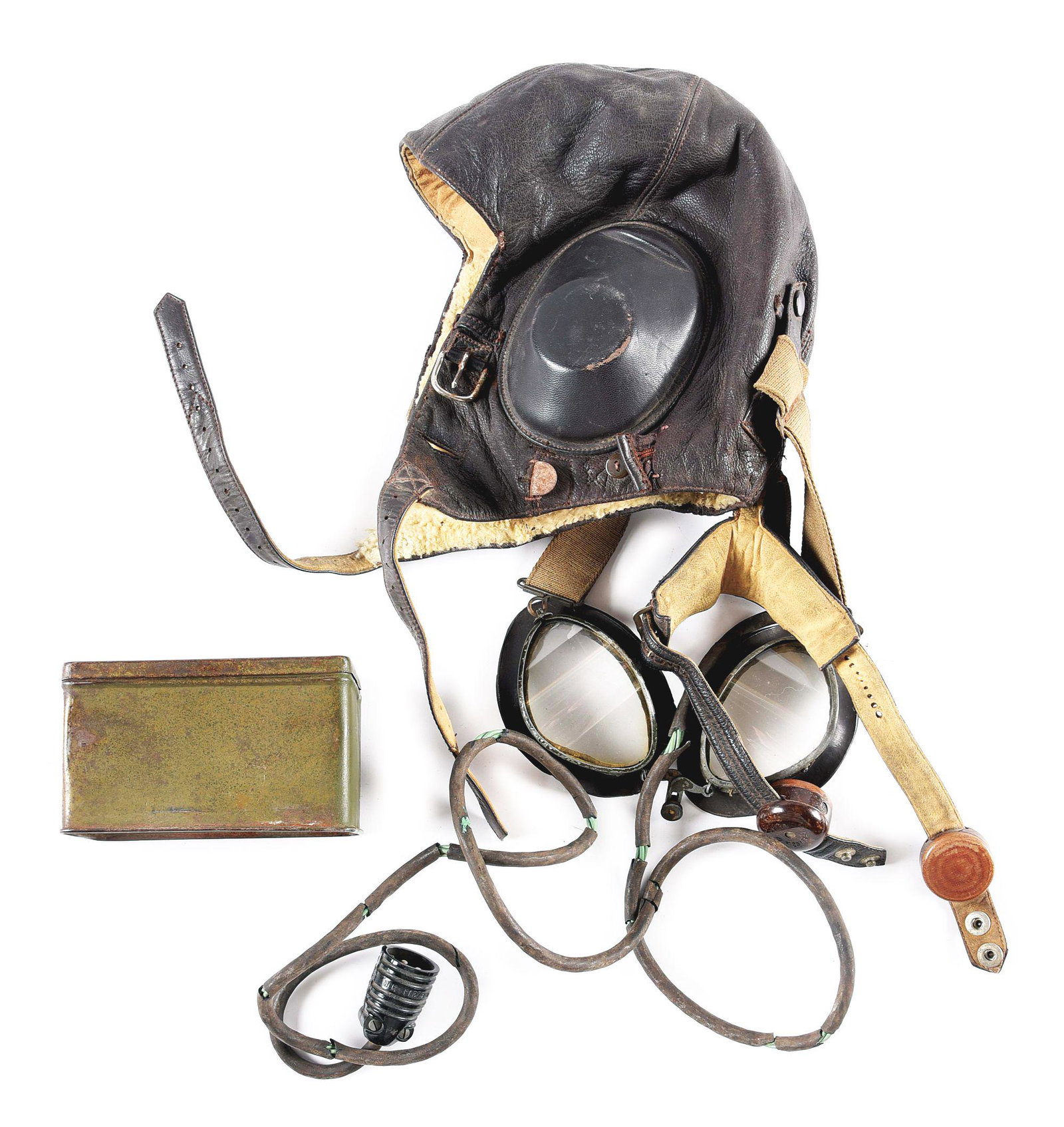 GERMAN WWII FLIGHT HELMET WITH GOGGLES AND EXTRA LENSES: German World War II Luftwaffe brown leather flight helmet with 2 maker tags sewn into its wool liner with moderate wear overall. Helmet has throat mikes and ear covers with speakers, and well as a fra