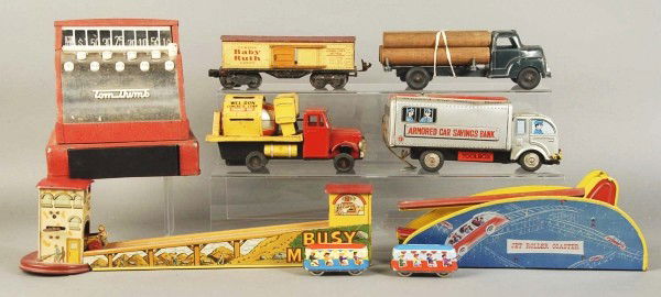 Lot of 7: Tin Toys.: Includes Baby Ruth train car, Busy Miners, armored truck, log truck, Jet Roller Coaster, concrete mixer, and cash register. Moderate wear throughout. Size: Largest: 17" L.