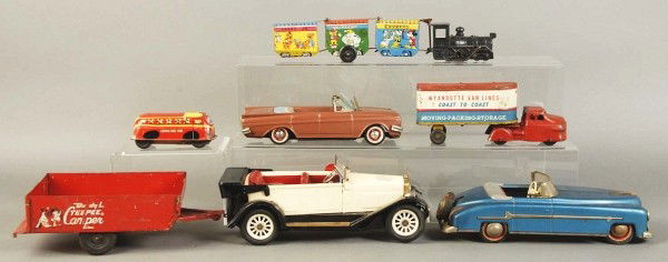 Lot of 7: Tin Toys.: Includes Wyandotte moving van, Disneyland train, Lupor bus, brown convertible, blue convertible, beige convertible, and a Buddy L Teepee camper. Moderate wear throughout. Size: Largest: 12 - 1/2" L.