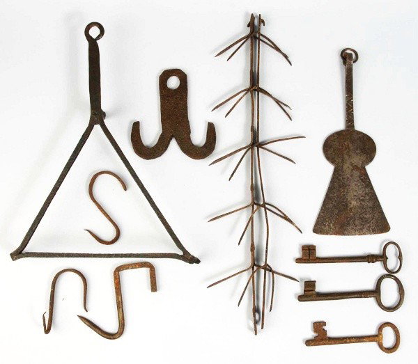 Lot of 10+ Hand Wrought Fireplace Pieces.: Includes a triangular shaped trivet, two spoked pieces to hold meat, three or four brass keys, several hooks, interesting spatula-type tool, and other items. Size: