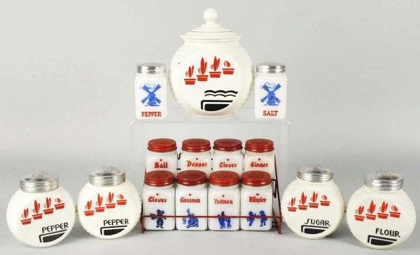 Lot of Range, Spice, & Salt and Pepper Sets.: 1930s to 1940s. Includes a set of eight Dutch Boy spice pieces with rack, original labels on backs, and some with spices inside. All with original tops. Anchor Hocking Corp. Vitrock set of five Deco f