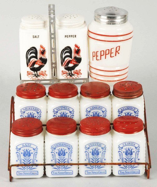 Lot of Range, Spice, & Salt and Pepper Sets.: 1930s to 1940s. Includes Spice Chest stylized tulip set of eight with original tops. Hazel Atlas pepper with red stripes and replaced top. Anchor Hocking grease jar with original tulip top. Also inclu
