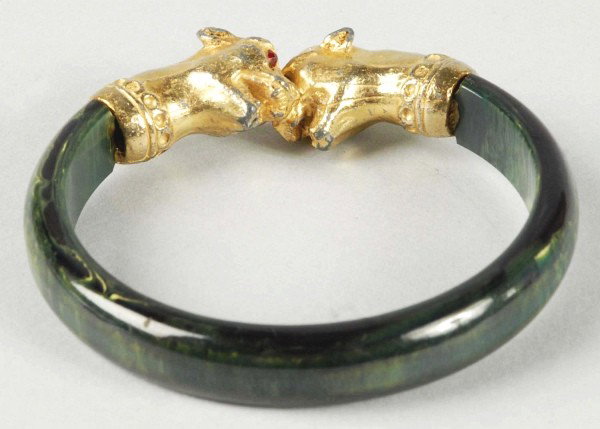 Bakelite Blue Moon Bangle Bracelet.: With panther heads and glass eyes. Size: 2 - 1/2" Dia.