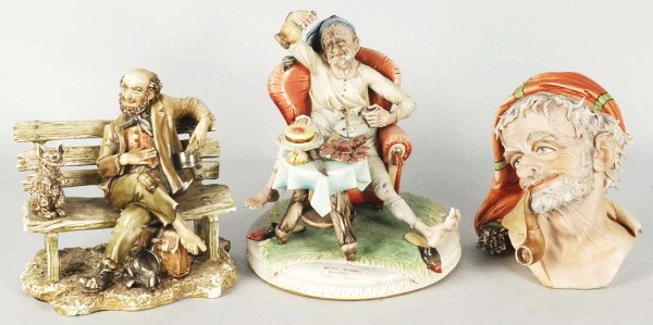 Lot of 3: Capodimonte Figures by Works of Art.: Includes one bust of an Arabic man with turban, pipe that has been broken off marked "Made in Italy". Also includes one seated gentleman in bed clothes with wine bottle and glass in hand and marked "G