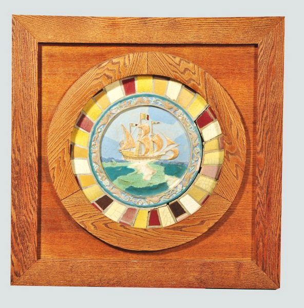 Rookwood Faience Rondel Ship Scene Tile.: Surrounded by contemporary ceramic tiles and housed in a contemporary oak frame. Some crazing on the Rookwood tile and minor separation between the contemporary tiles. Size: Framed: 36 - 1/2" x 36 - 1