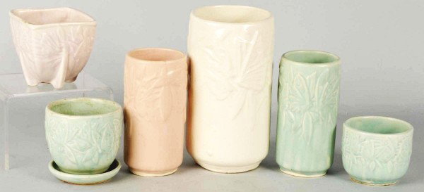 Lot of 6: McCoy Art Pottery Pieces.: 1940s to 1950s. Nelson McCoy Pottery Company. Butterfly line cylinder vase in matte white finish with some interior crazing. Butterfly line square jardiniere in matte lavender finish. Butterfly line c