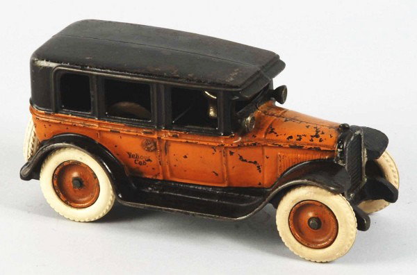 Cast Iron Arcade No. 5 GMC Limo Yellow Cab Toy.: American. Rear mounted spare rubber tire. Original driver and windshield mounted headlights. No. 360 license plate. Rubber stamped "Yellow Cab" on side doors and Arcade Toy decal in front of driver's 