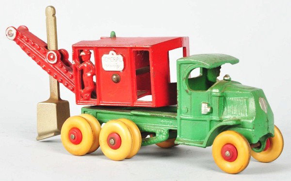 Cast Iron Hubley General Digger Truck Toy.: American. Marked "General" on both sides of back end. Some minor touchup and paint chipping throughout. Replaced tires. Size:10" L.