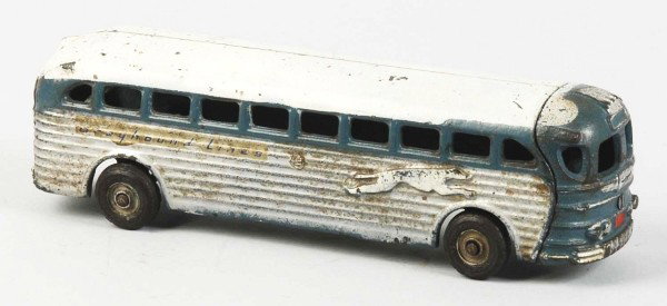 Cast Iron Arcade Greyhound Bus Toy.: American. Black rubber tires. Arcade sticker on bottom and Greyhound Lines decals on sides. Some scratching and wear throughout. Size:9" L.