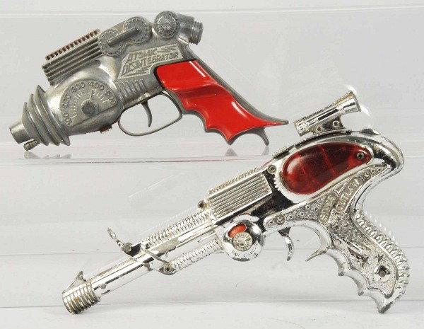 Lot of 2: Vintage Space Gun Toys.: Includes English Lone Star Space Outlaw and Hubley Atomic Disintegrator Gun. Both guns show some wear. Size:Largest: 10" L.