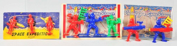 Lot of Carded Best & Plastic Craft Space Figures.: Circa 1950s. Very scarce. All three sets on original cards. Two sets are Best Rocket Gun Space Rangers and one is a Plastic Craft set with three figures. Figures are held on with rubber bands, some ar