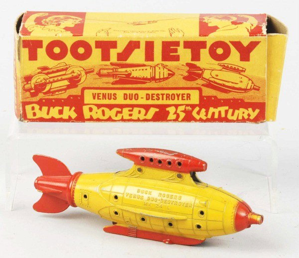 Diecast Tootsietoy Buck Rogers Destroyer Ship.: Marked "Venus Duo-Destroyer" and "MK24L". Some minor chipping and wear to toy. Includes original box marked "Copyright 1937 John F. Dille" with some creasing and missing three of four inner flaps. Siz