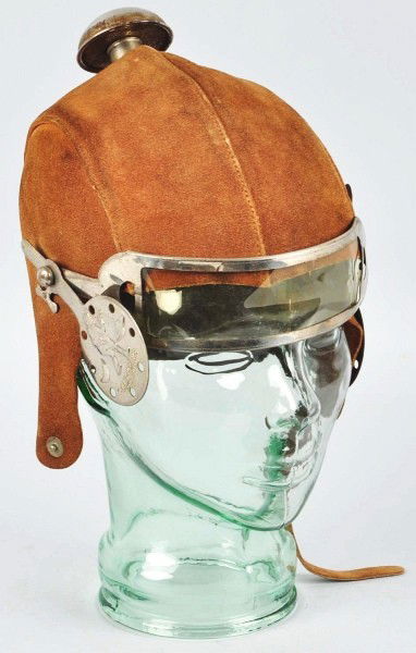 Buck Rogers Suede Space Helmet.: 1934. Include visor and metal embossed ear pieces. Some oxidation on shield and top piece and some age/staining throughout. Size:8 - 1/2" T.