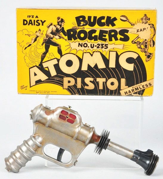 Daisy Buck Rogers Atomic Pistol.: Circa 1946. Pistol number U235. Includes original box. Size:10" L.