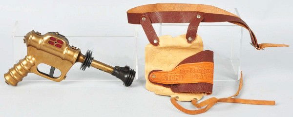 Daisy Buck Rogers Atomic Pistol & Holster Set.: Pistol number U238. Holster marked "Buck Rogers Atomic Pistol". Includes original box with some creasing and wear. Size:10" L.