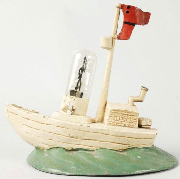 Cast Iron Popeye Toy Lamp.: Working. Includes original light bulb with Popeye figure inside. Original mast has broken flag. Some paint chipping and wear. Size:7" T.