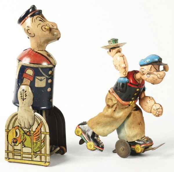 Lot of 2: Vintage Tin Litho Popeye Wind-Up Toys.: Working. Includes one Linemar Skater and one Marx Popeye Walking with Parrot Cages. Both toys with original pipes. Heavy wear overall. Size:Largest: 8 - 1/4" T.