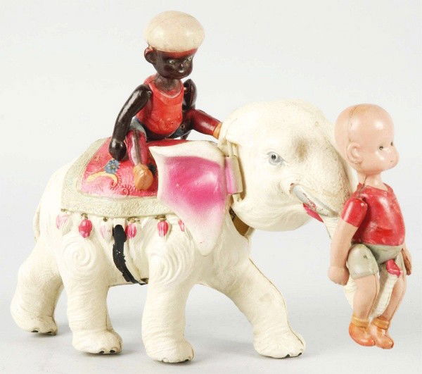 Celluloid Henry on Elephant Wind-Up Toy.: Japanese. When wound, elephant's head moves up and down while Henry rides on trunk and Mahout rides on back. Some overall wear. Size:8 - 1/2" L.