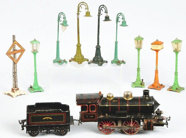 Lot of European & American Train Items.: Includes European gauge 1 steam-type train engine and tender and nine American Lionel lamp post accessories. Some paint loss and wear to engine and tender and one or two lamp posts are repaired. Size:
