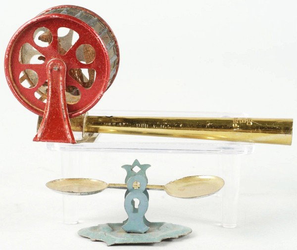 Lot of 2: Tin Penny Toys.: German. Includes one squirrel in cage blow toy and one scale. Some wear overall. Size:Largest: 4 - 3/4" L.