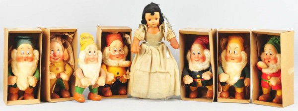 Complete Set of Snow White & 7 Dwarf Dolls.: Oil cloth faces, original clothing, and original tags that say "Walt Disney Characters made Exclusive with R.G. Krueger New York". Snow White has some darkening on her chest and arms while the dwarves