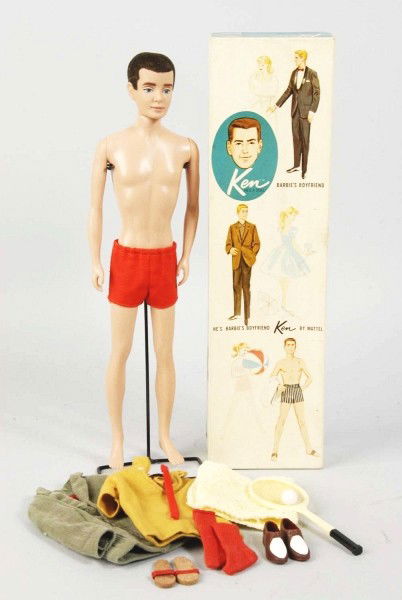 Boxed 1961 No. 1 Ken Doll by Mattel.: First doll with stand and shorts, sandals, socks, trunks, shirt, coat, towel, tennis racket, and tie. Doll is mint and box is excellent. Size:Box: 12 - 3/4" x 3 - 1/2".