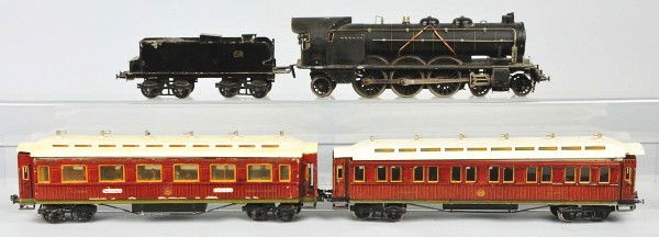 Marklin Gauge 1 PLM Passenger Train Set.: Description German. Locomotive marked "PLM1021". Handpainted engine with clockwork motor and matching PLM eight wheel tender. Includes two handpainted passenger cars with full interiors consisting of